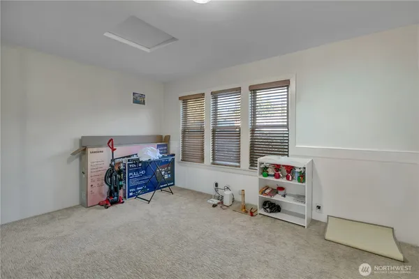 a bedroom with furniture and a window