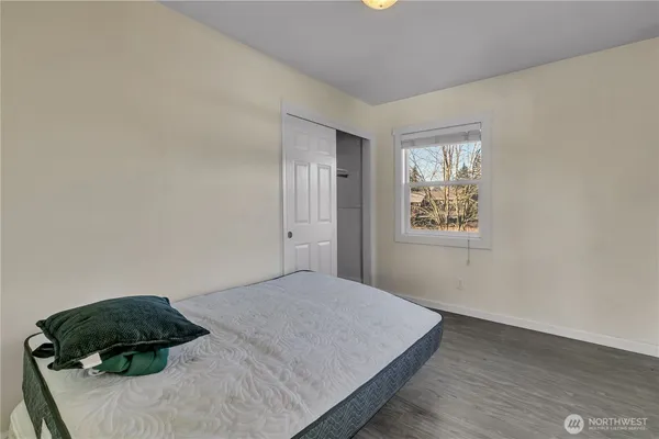 a bedroom with a bed and a cabinets