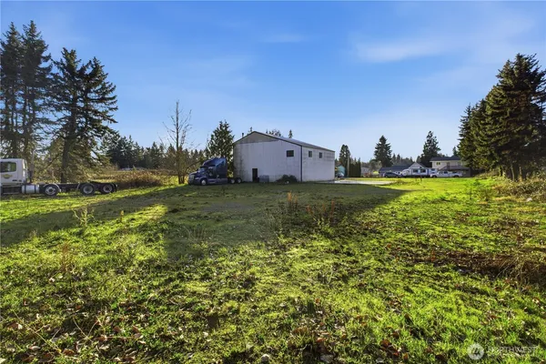 a view of a big yard with a house