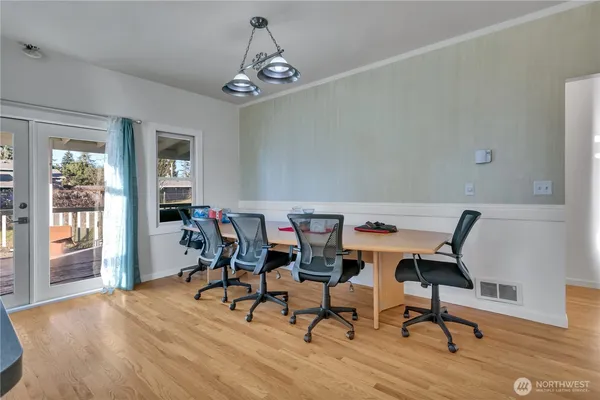 a work room with furniture and wooden floor