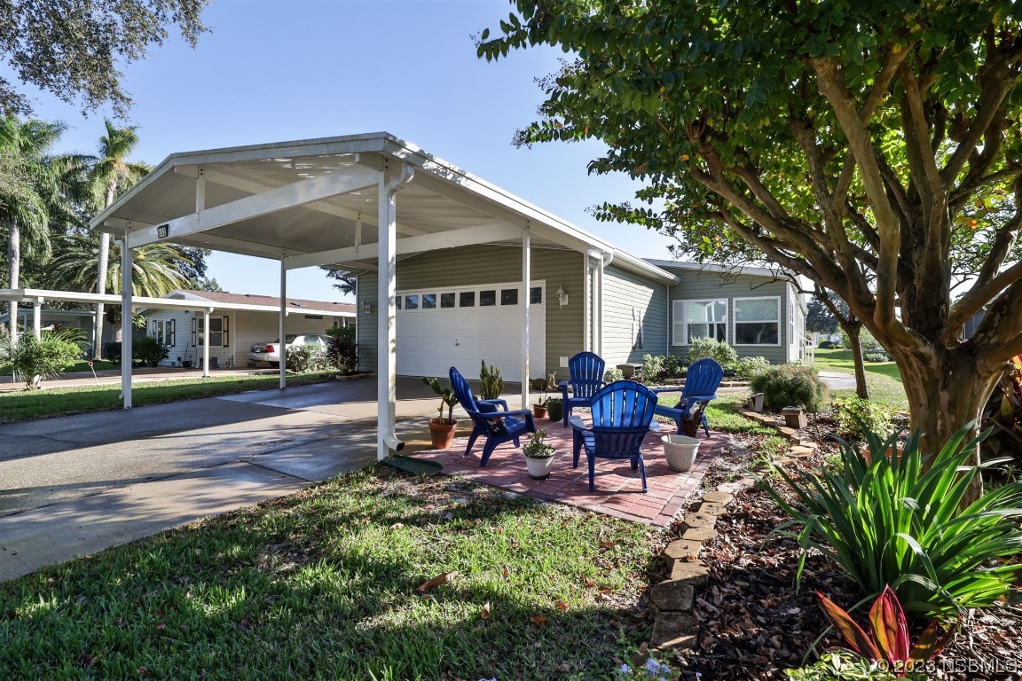 502 Topside Circle Edgewater, FL 32141 - Photo 2 of 28 a view of a house with backyard and sitting area