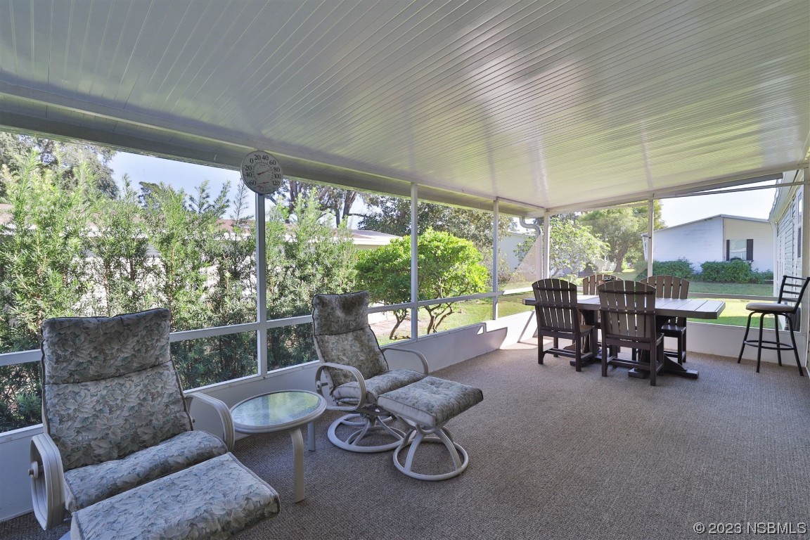 502 Topside Circle Edgewater, FL 32141 - Photo 6 of 28 a living room with furniture and a large window
