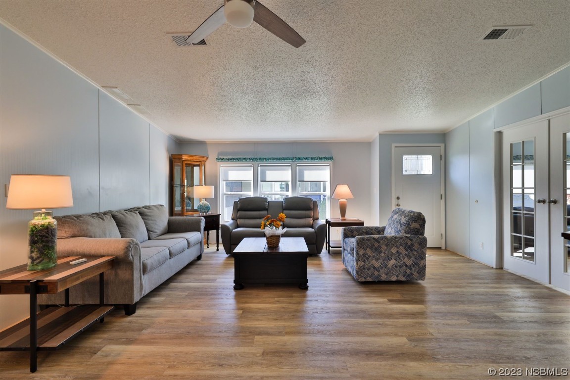502 Topside Circle Edgewater, FL 32141 - Photo 7 of 28 a living room with furniture and a wooden floor