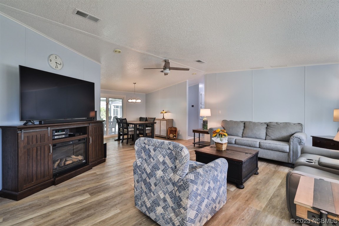 502 Topside Circle Edgewater, FL 32141 - Photo 8 of 28 a living room with furniture and a flat screen tv
