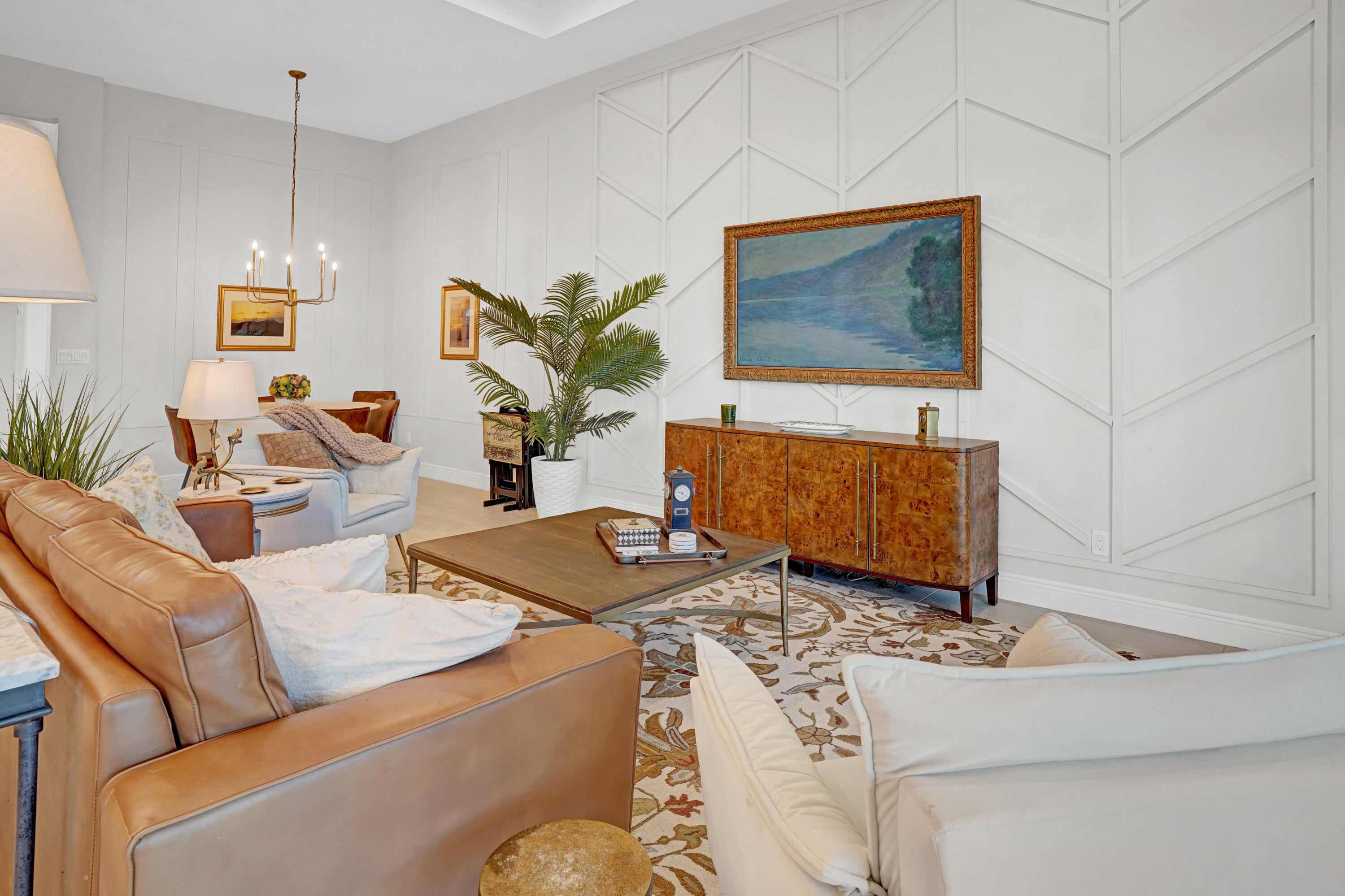 23005 Southwest Accesi Way Port St. Lucie, FL 34986 - Photo 16 of 80 a living room with furniture and a flat screen tv