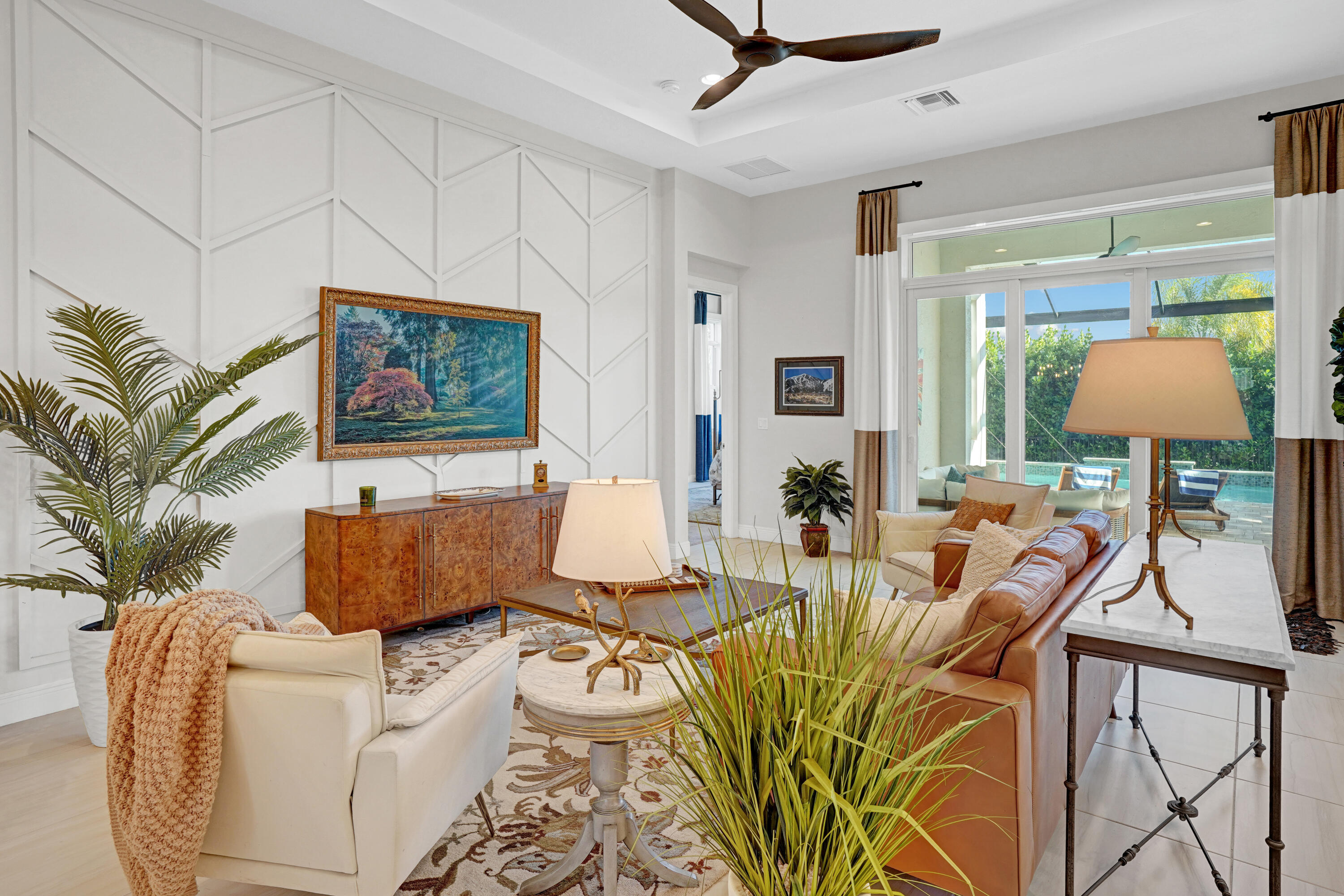 23005 Southwest Accesi Way Port St. Lucie, FL 34986 - Photo 17 of 80 a living room with furniture and a flat screen tv