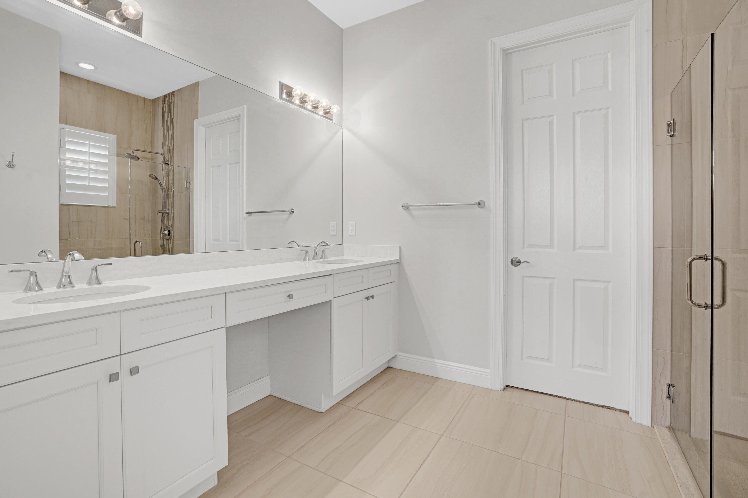 23005 Southwest Accesi Way Port St. Lucie, FL 34986 - Photo 30 of 80 a bathroom with a double vanity sink and a mirror