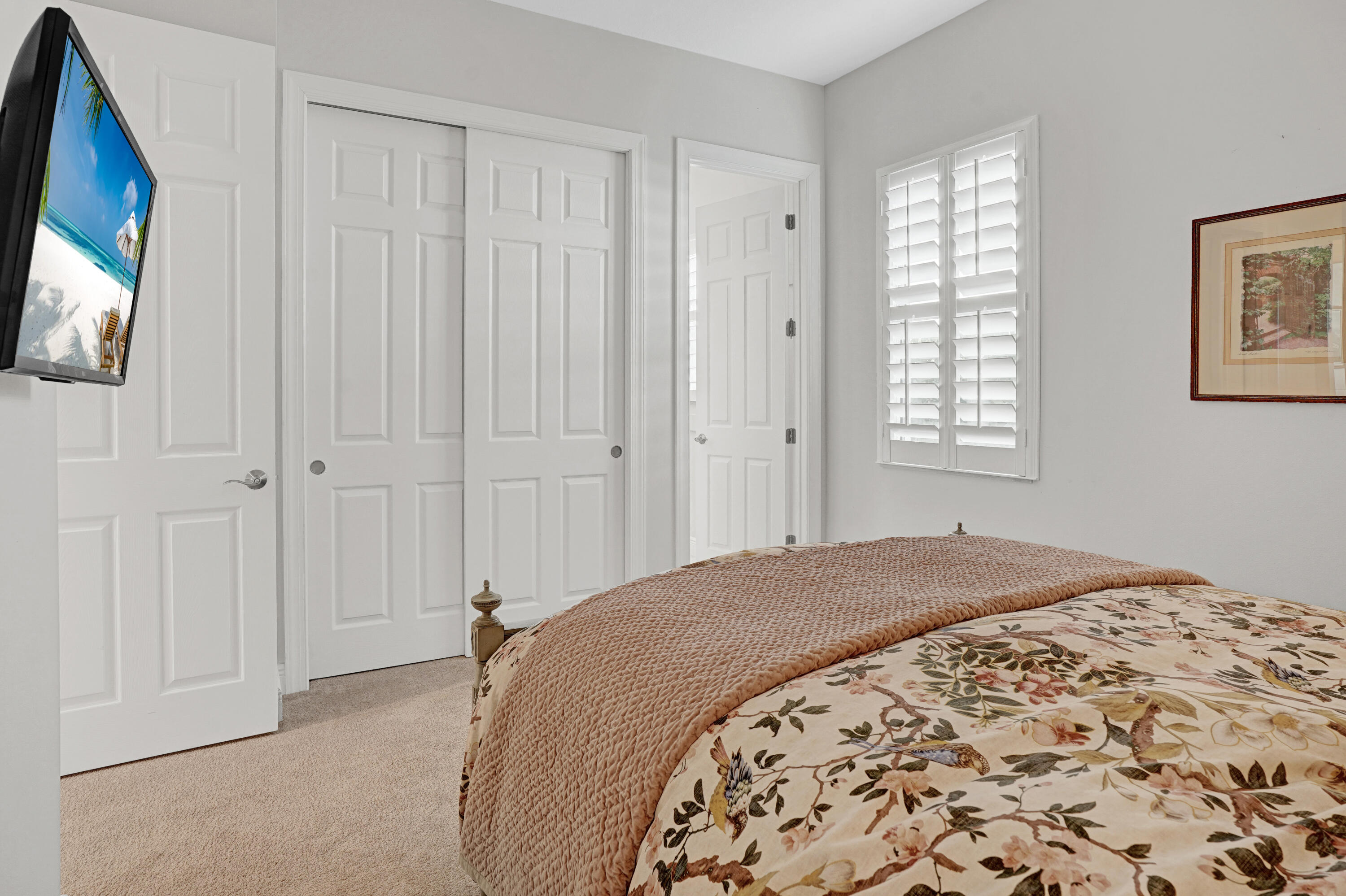 23005 Southwest Accesi Way Port St. Lucie, FL 34986 - Photo 33 of 80 a bedroom with a bed and a flat screen tv