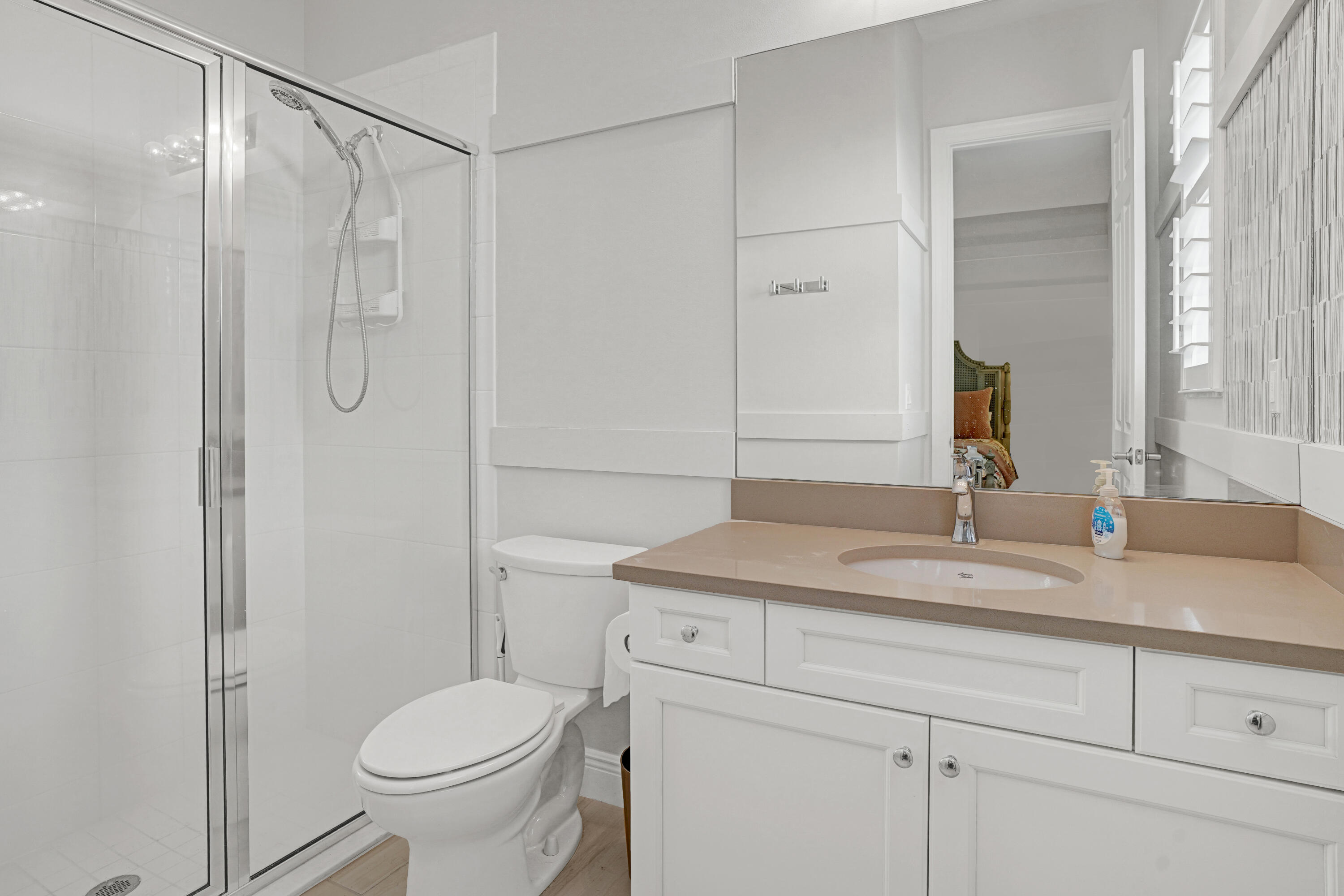 23005 Southwest Accesi Way Port St. Lucie, FL 34986 - Photo 34 of 80 a bathroom with a granite countertop sink toilet and shower