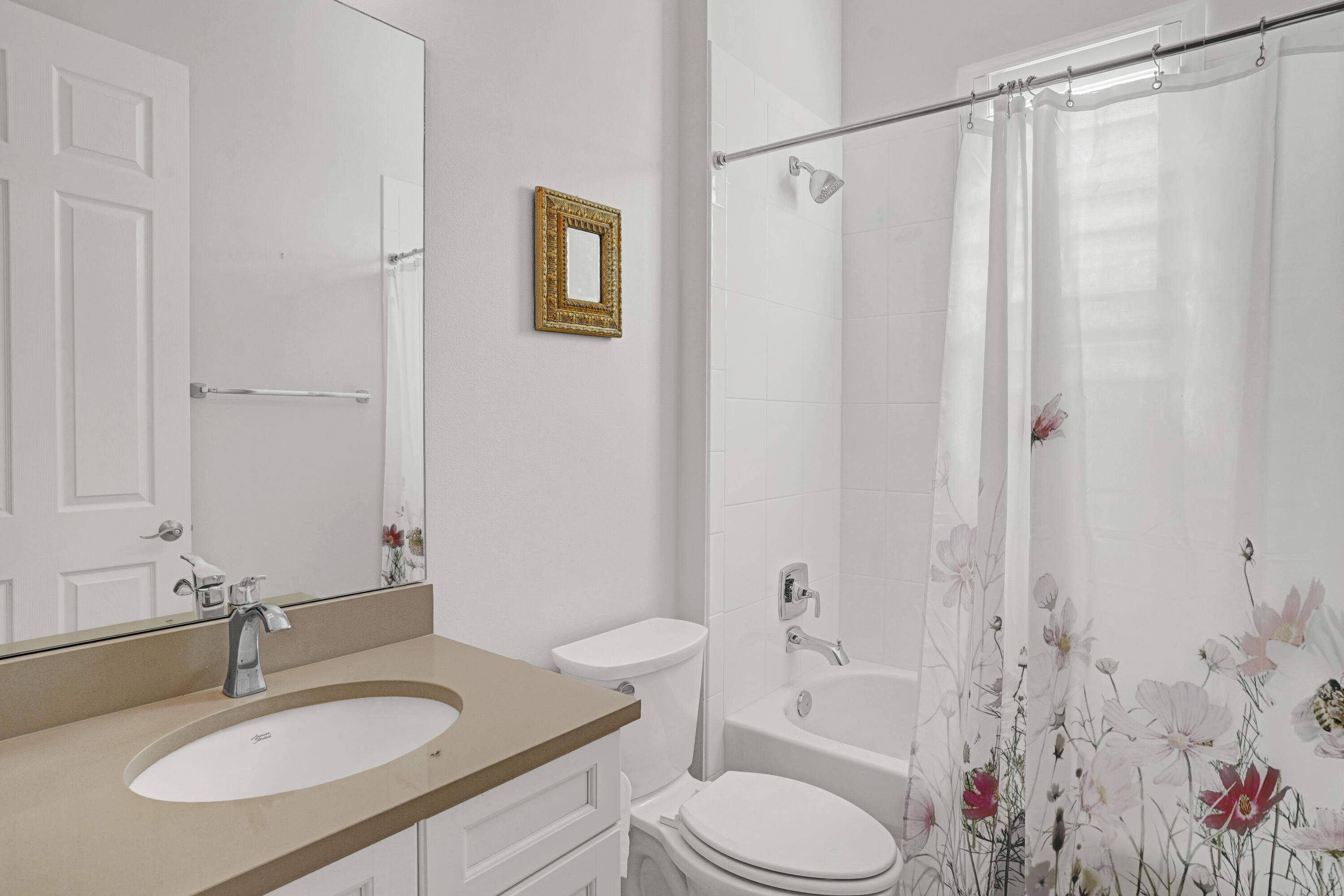 23005 Southwest Accesi Way Port St. Lucie, FL 34986 - Photo 37 of 80 a bathroom with a sink toilet a shower and a mirror