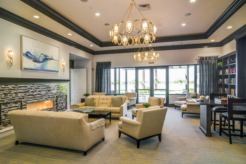 23005 Southwest Accesi Way Port St. Lucie, FL 34986 - Photo 57 of 80 a living room with furniture and a chandelier