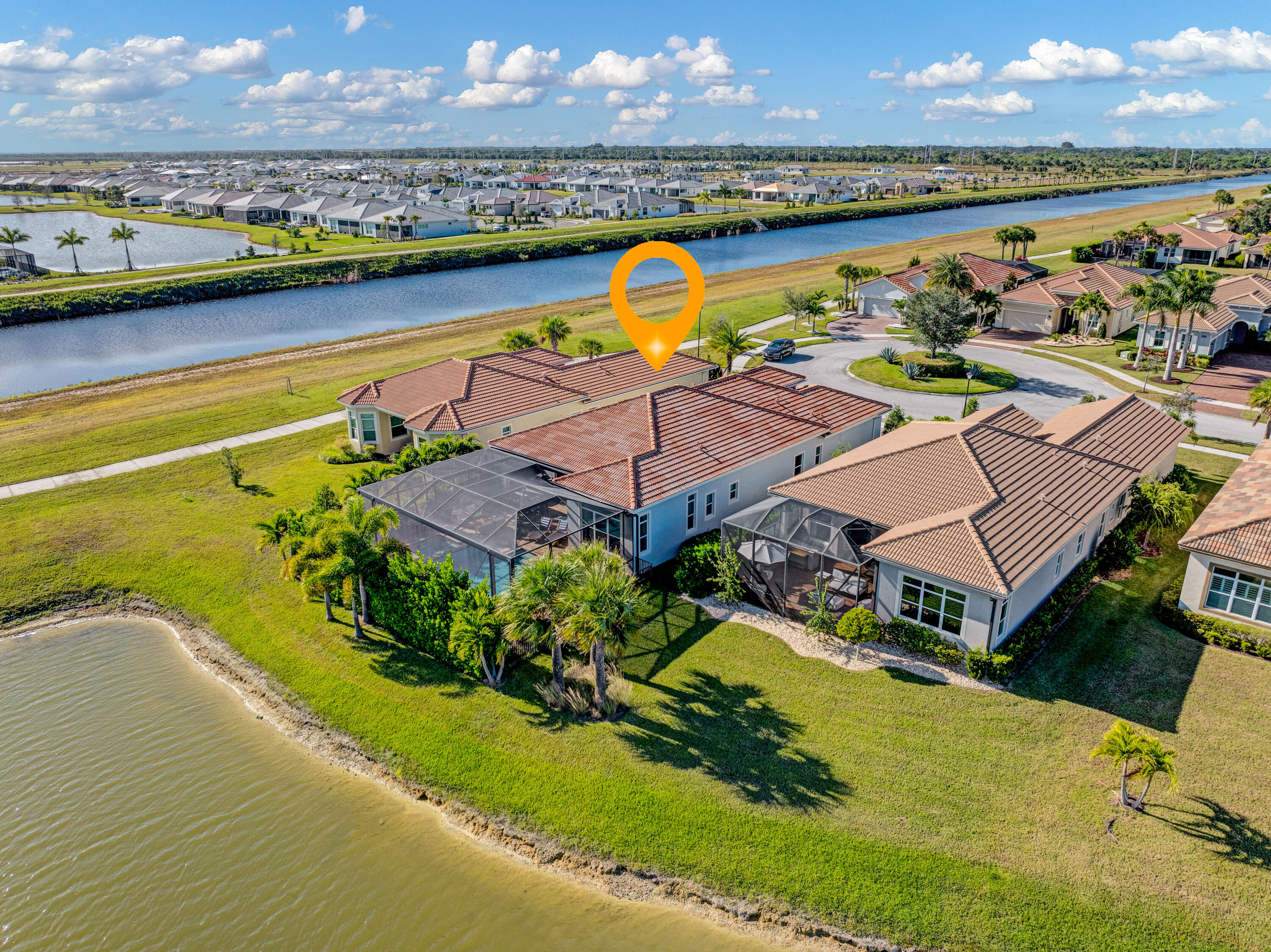 23005 Southwest Accesi Way Port St. Lucie, FL 34986 - Photo 6 of 80 an aerial view of residential houses with outdoor space and lake view
