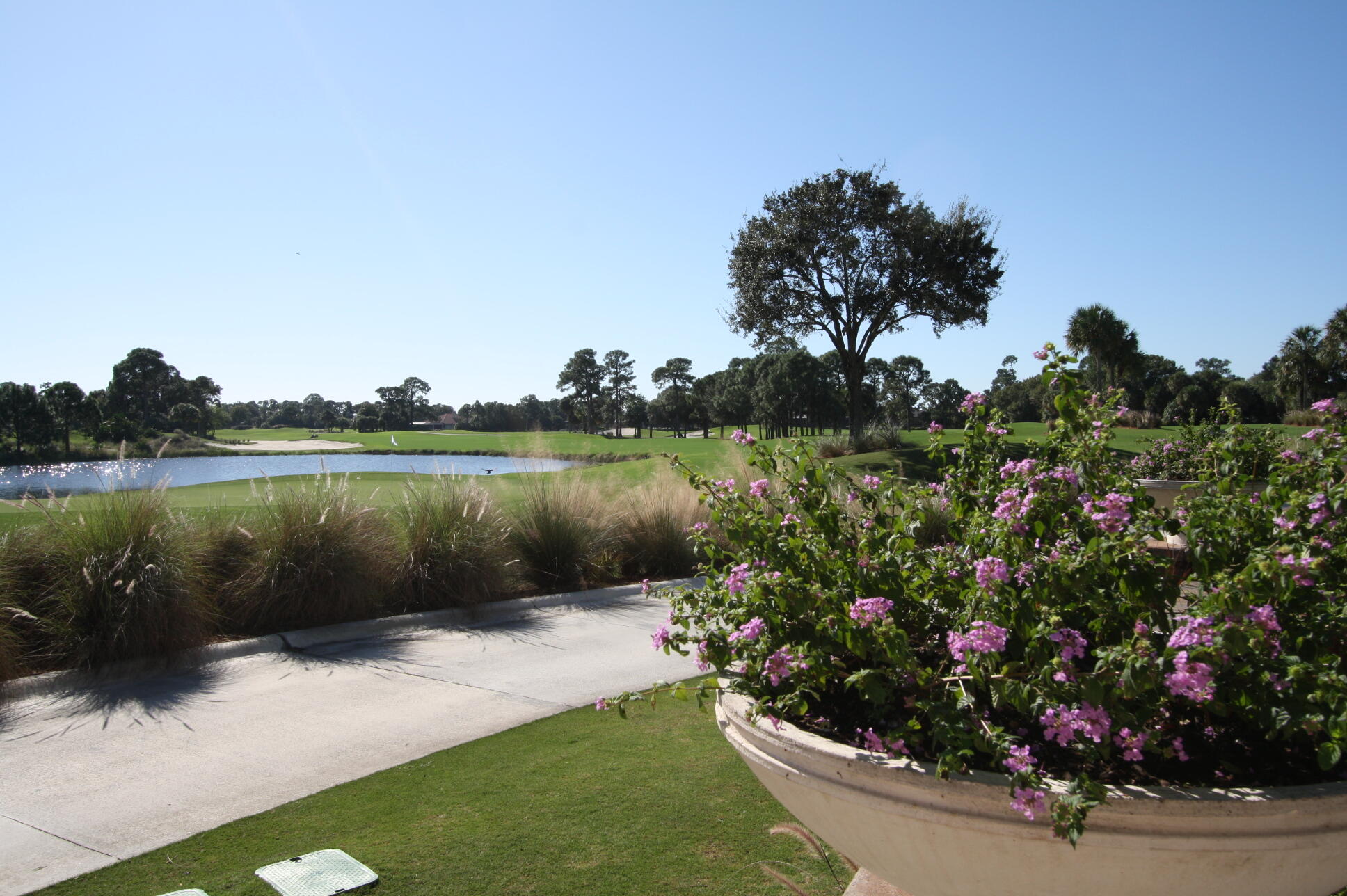 23005 Southwest Accesi Way Port St. Lucie, FL 34986 - Photo 79 of 80 a view of a lake with a house in background