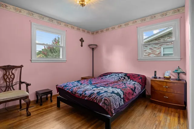 a bedroom with a bed and a dresser