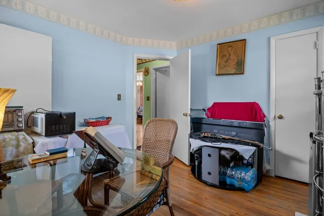 a workspace with furniture and wooden floor