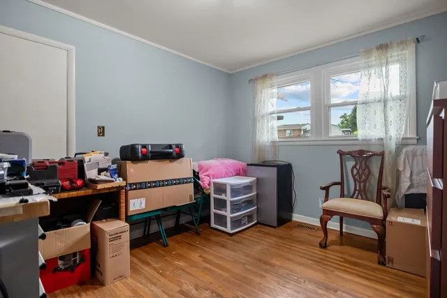 a bedroom with furniture and a window