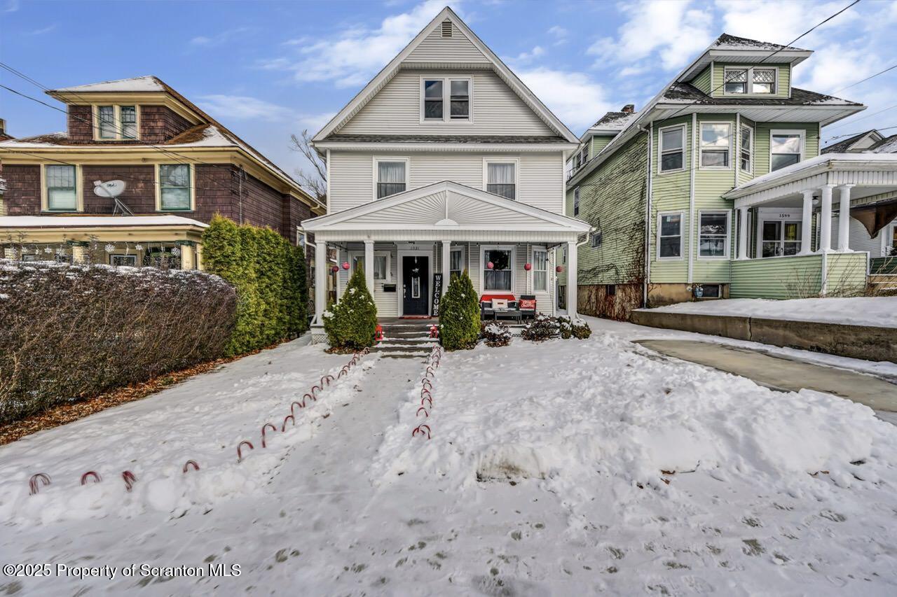 1531 Electric Street Dunmore, PA 18509 - Photo 1 of 56 front view of a house with a yard
