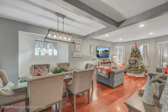 a living room with furniture or kitchen and a chandelier
