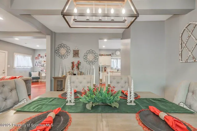 a living room with furniture and flowers