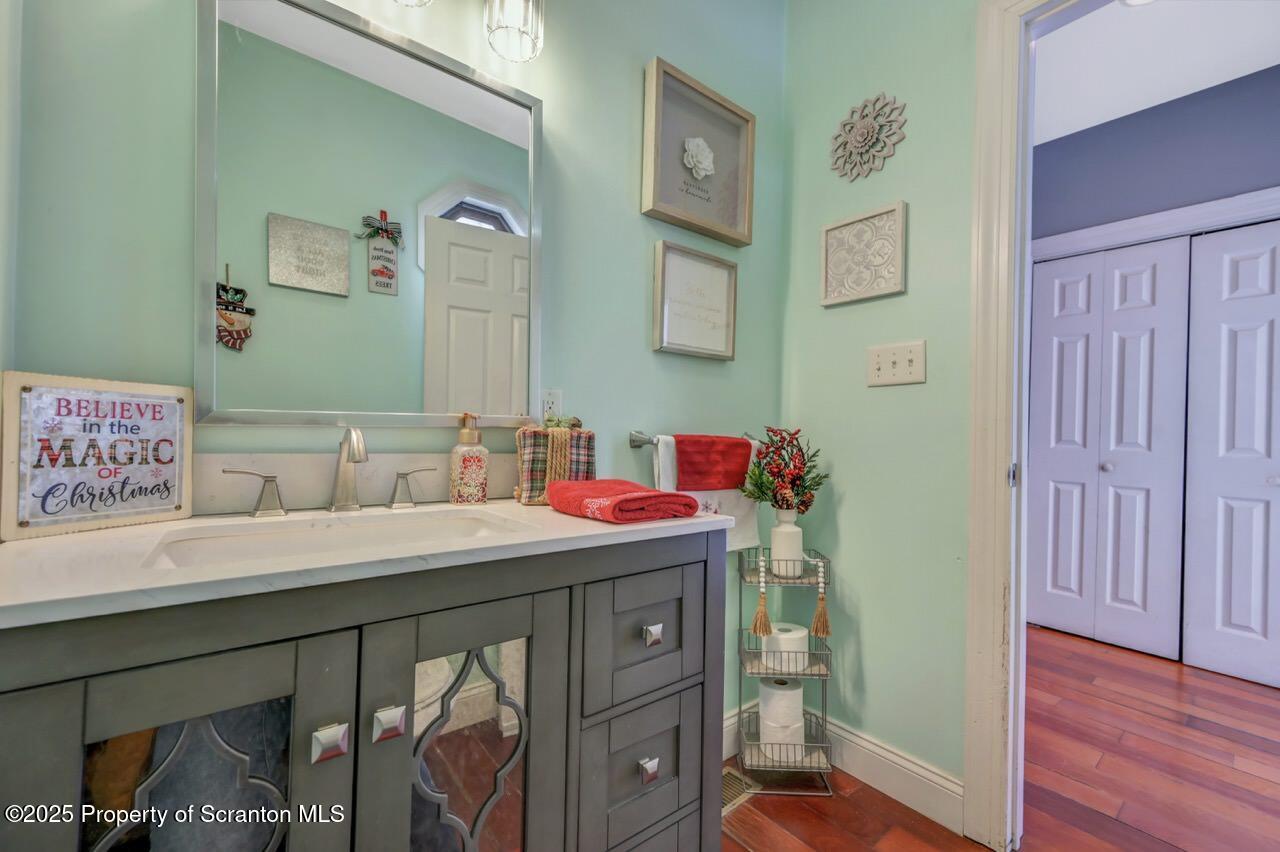 1531 Electric Street Dunmore, PA 18509 - Photo 24 of 56 a bathroom with a sink vanity mirror and toilet