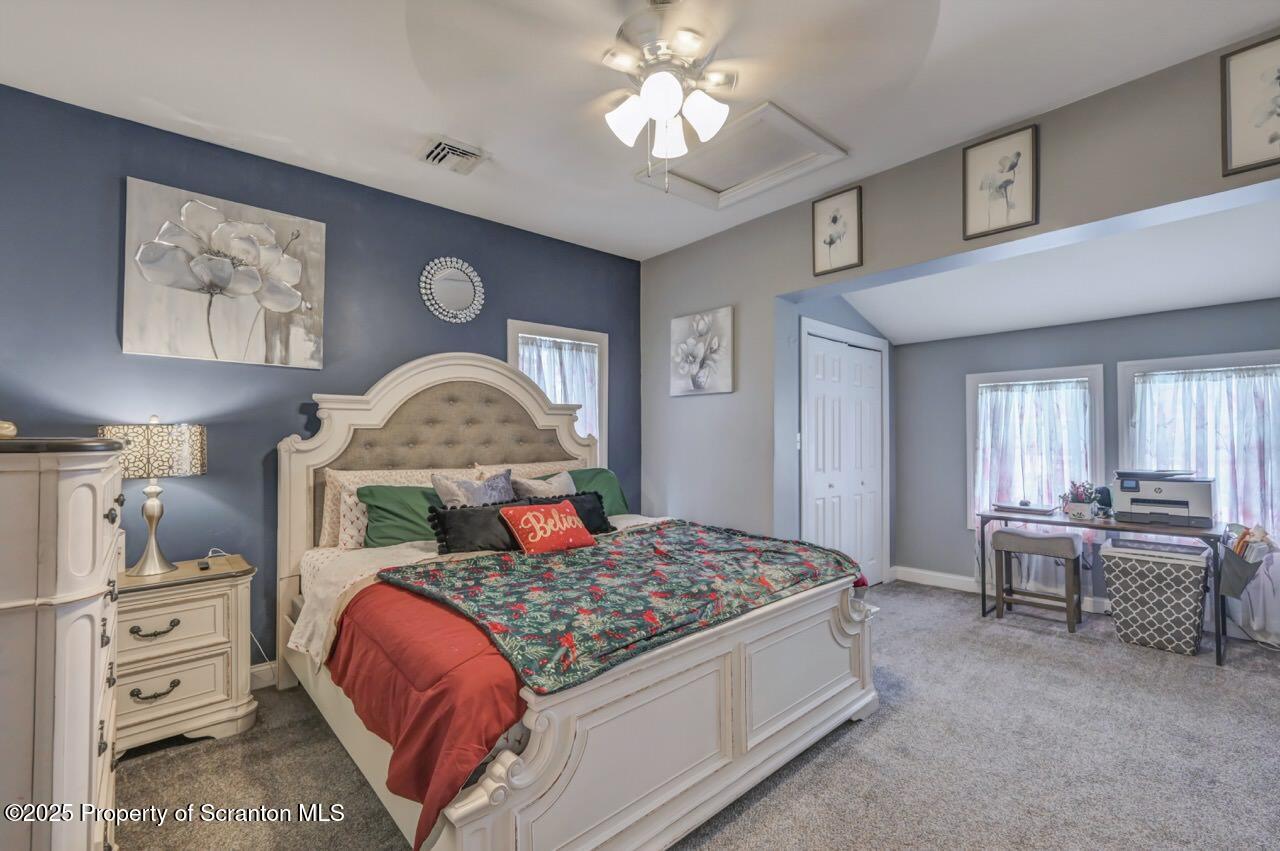 1531 Electric Street Dunmore, PA 18509 - Photo 28 of 56 a bedroom with a bed and a chandelier