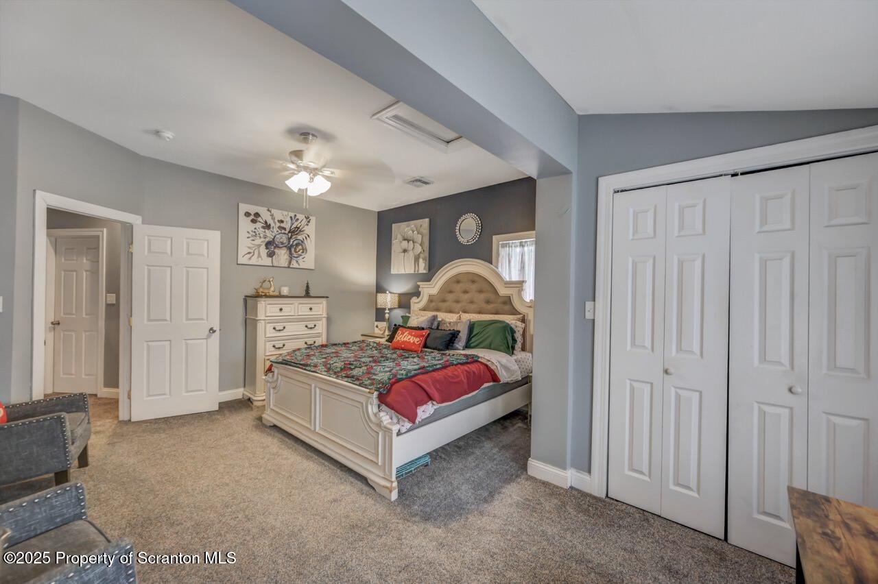 1531 Electric Street Dunmore, PA 18509 - Photo 29 of 56 a bedroom with a bed and a chandelier