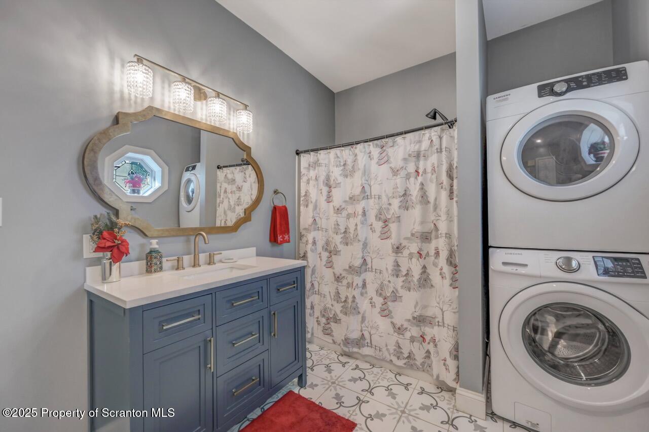 1531 Electric Street Dunmore, PA 18509 - Photo 33 of 56 a bathroom with a sink and a washer dryer