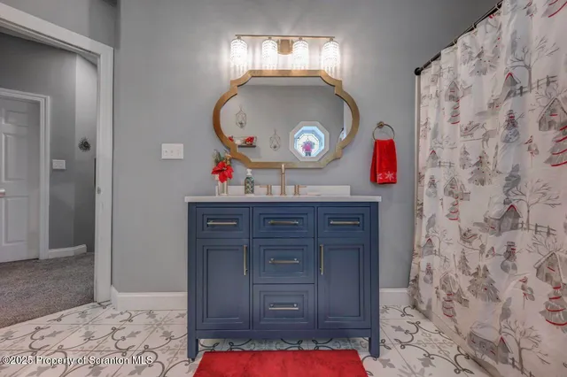 a bedroom with furniture and a flat screen tv