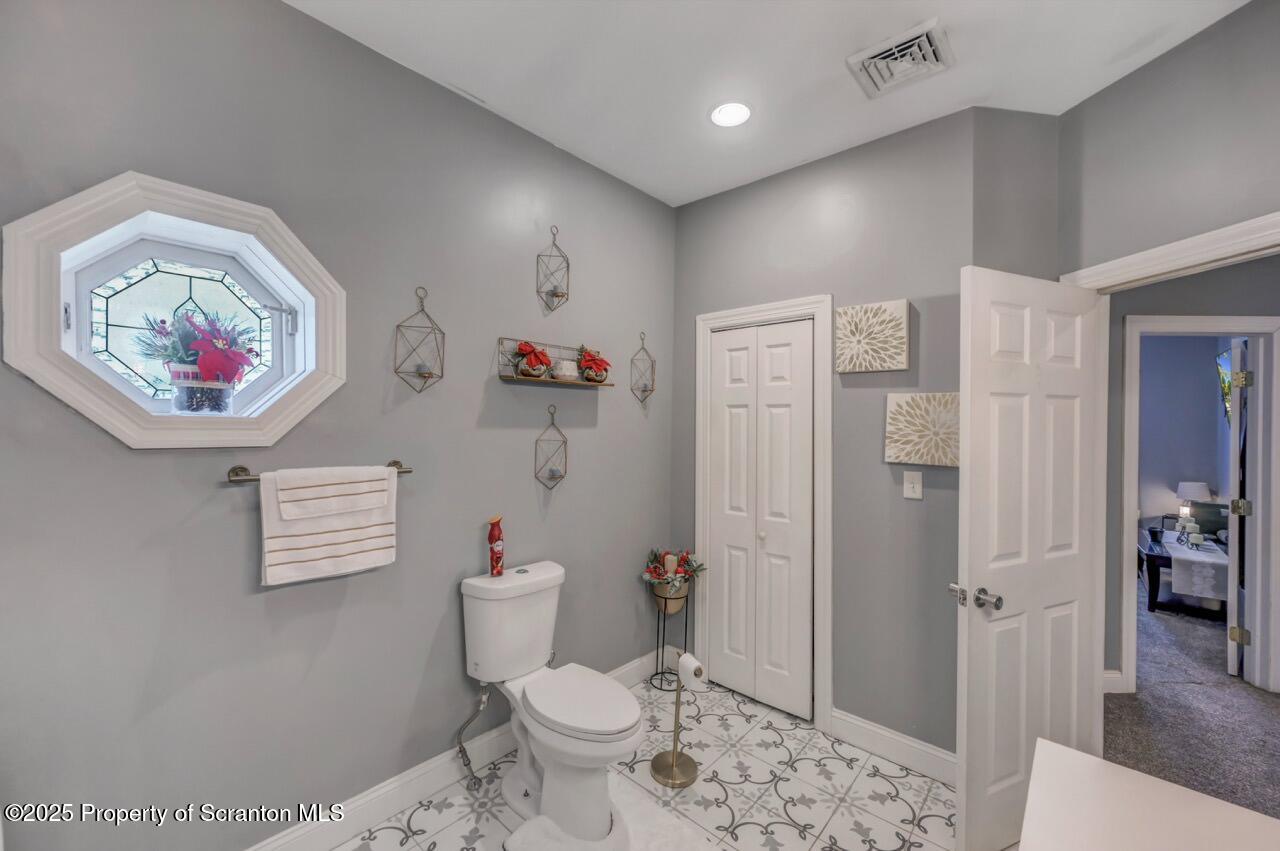 1531 Electric Street Dunmore, PA 18509 - Photo 36 of 56 a bathroom with a toilet a sink and a shower