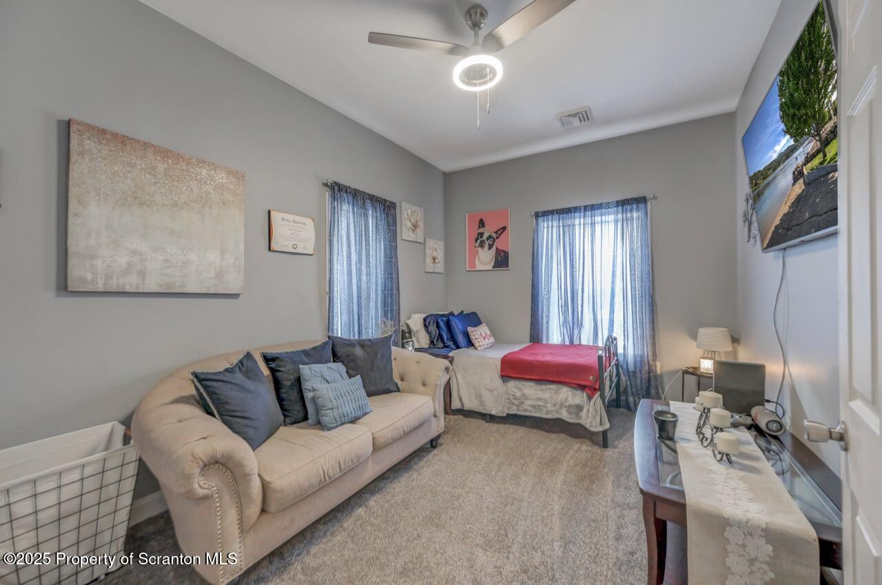 1531 Electric Street Dunmore, PA 18509 - Photo 37 of 56 a living room with furniture and a chandelier