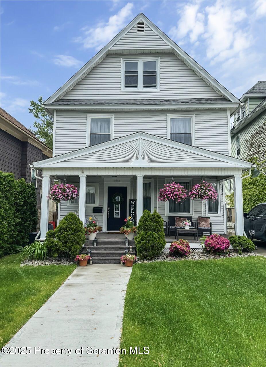 1531 Electric Street Dunmore, PA 18509 - Photo 50 of 56 a front view of a house with garden