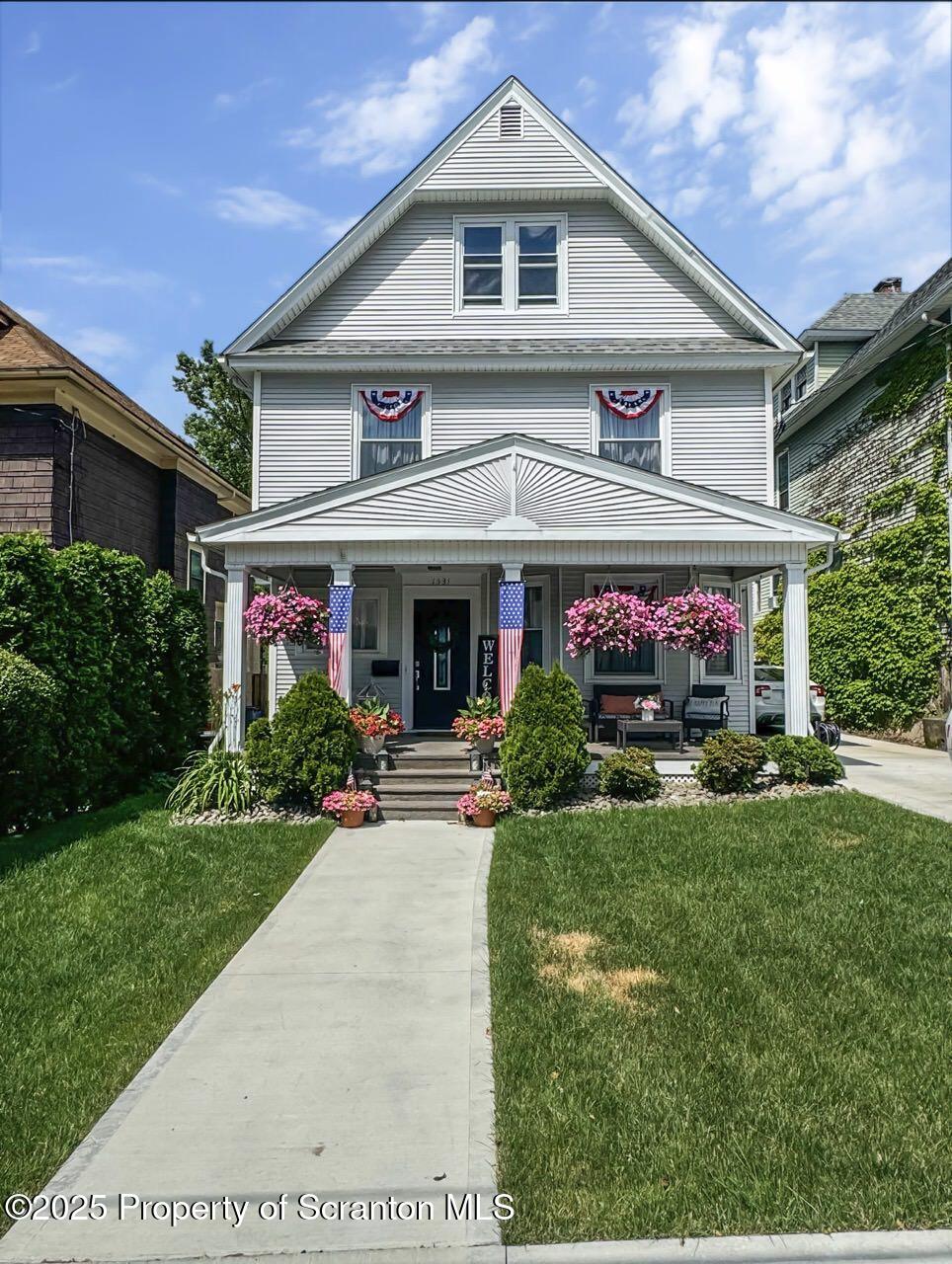 1531 Electric Street Dunmore, PA 18509 - Photo 51 of 56 a front view of a house with garden