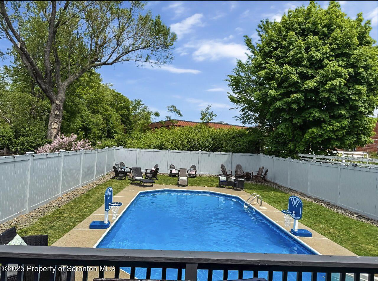 1531 Electric Street Dunmore, PA 18509 - Photo 52 of 56 a view of swimming pool with seating area and trees in the background