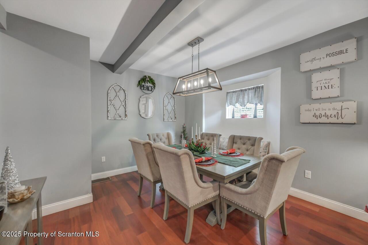 1531 Electric Street Dunmore, PA 18509 - Photo 10 of 56 a dining room with furniture a rug and wooden floor