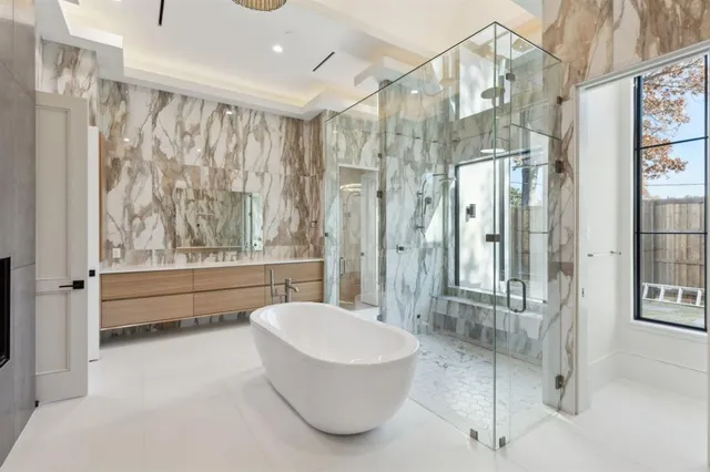 a bathroom with a tub shower and sink