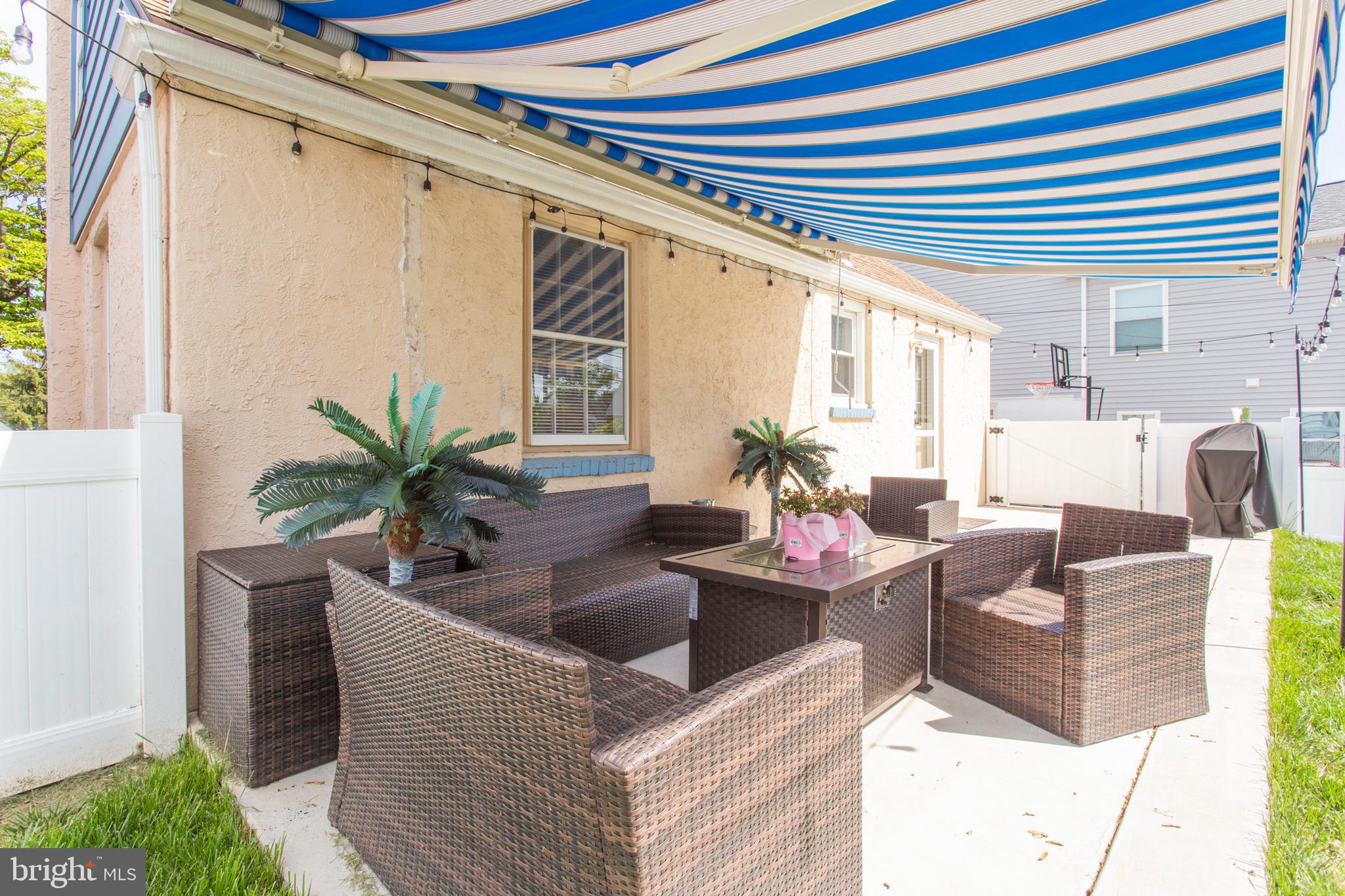 215 Rolling Road Broomall, PA 19008 - Photo 31 of 36 Newer concrete patio with retractable awning!