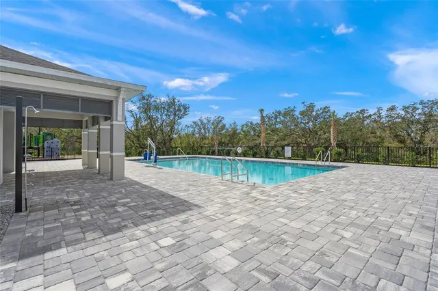a view of house with a swimming pool