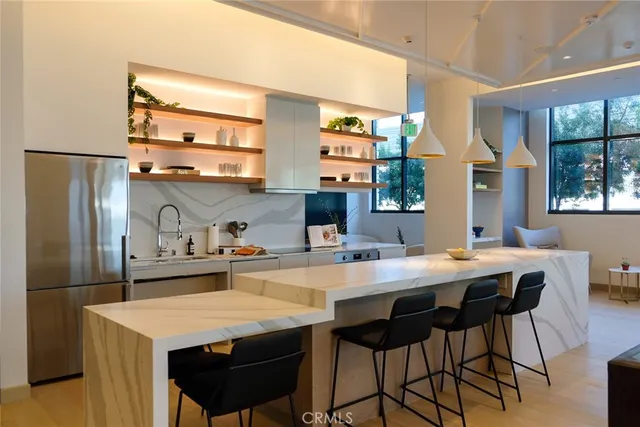 a kitchen with a table and chairs in it