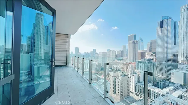 a view of a city from a corridor