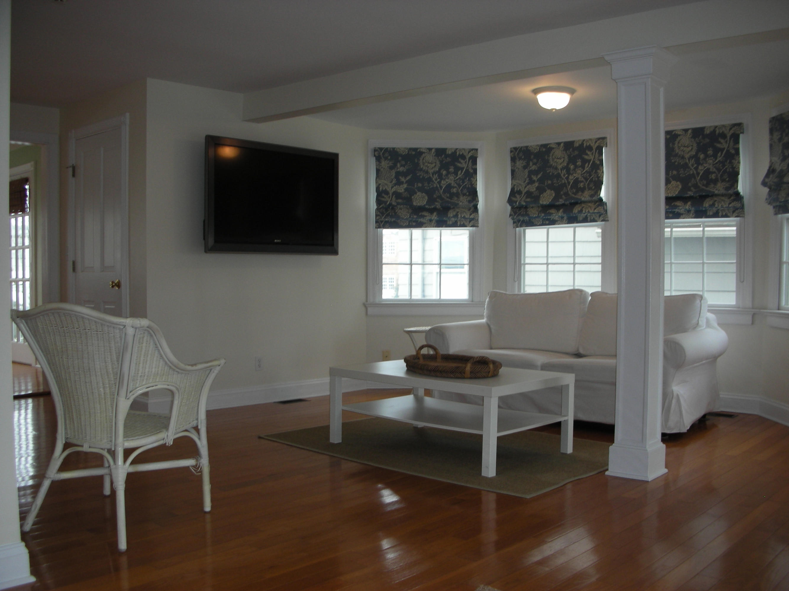 25 Ensign Road Rowayton, CT 06853 - Photo 8 of 22 a living room with furniture a flat screen tv and windows