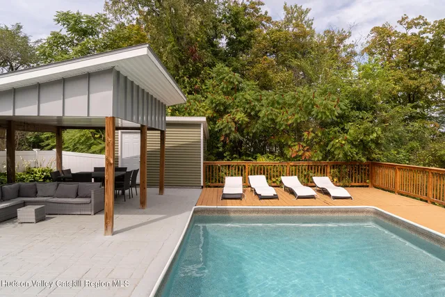 a view of a chairs and tables in the patio