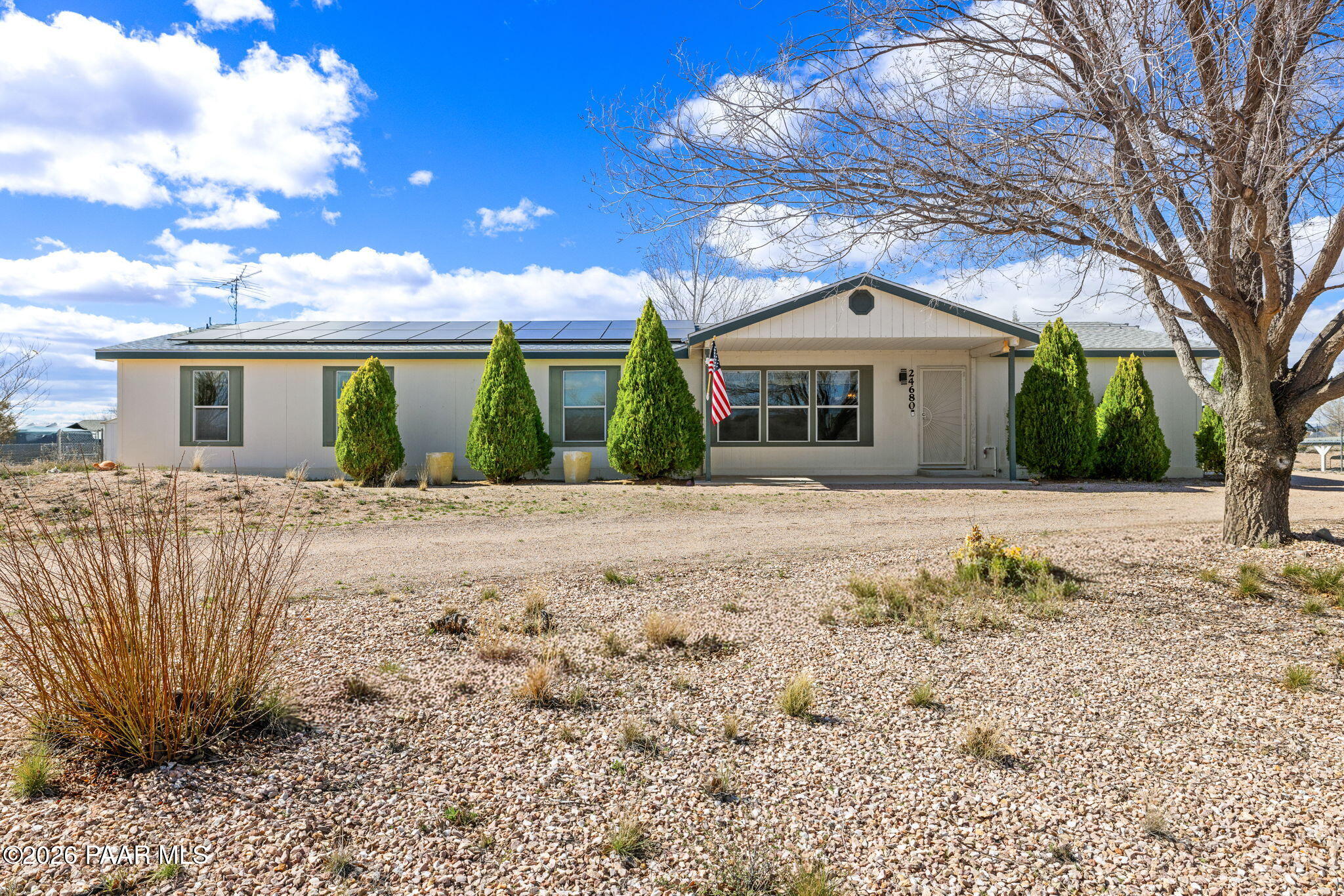 24680 North St Louis Street Paulden, AZ 86334 - Photo 1 of 33 a front view of a house with a yard