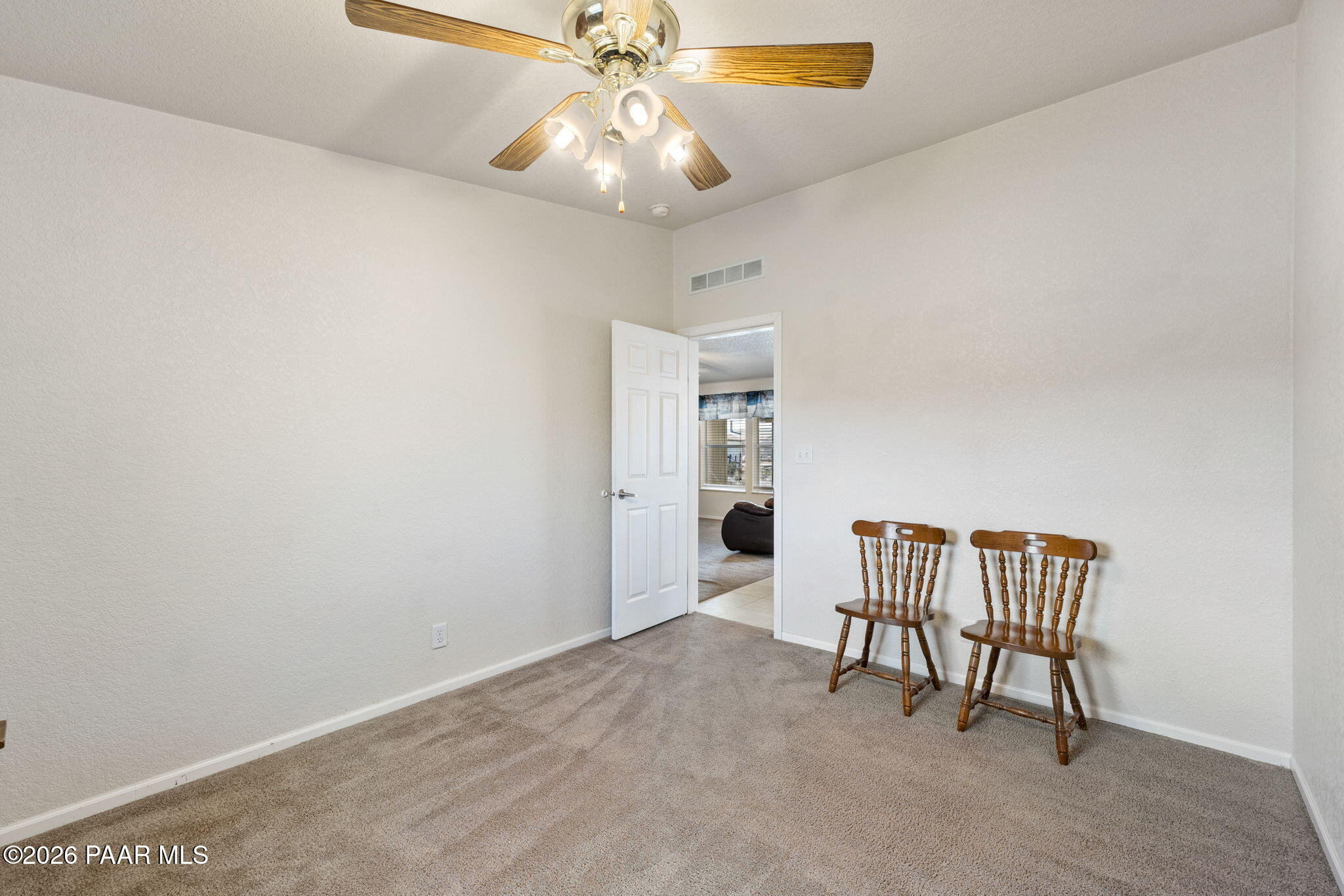 24680 North St Louis Street Paulden, AZ 86334 - Photo 13 of 33 en empty room with windows and ceiling fan
