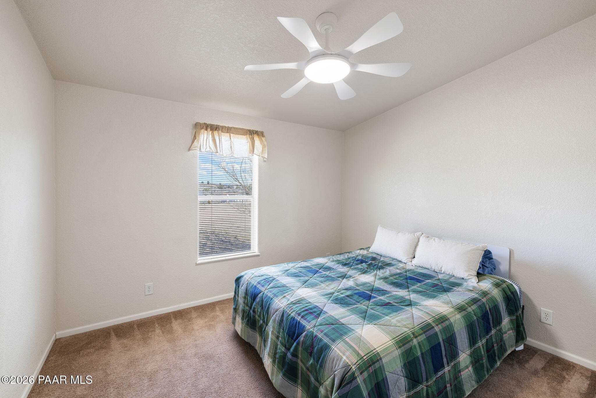 24680 North St Louis Street Paulden, AZ 86334 - Photo 15 of 33 a bedroom with a bed and a window