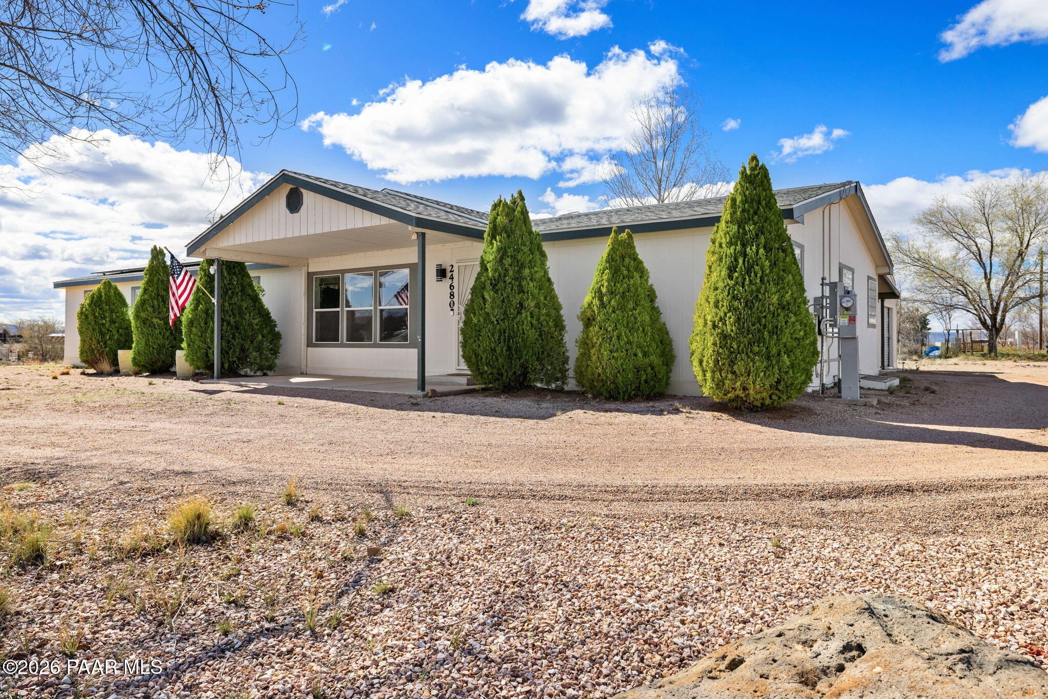 24680 North St Louis Street Paulden, AZ 86334 - Photo 2 of 33 a view of a white house with a yard