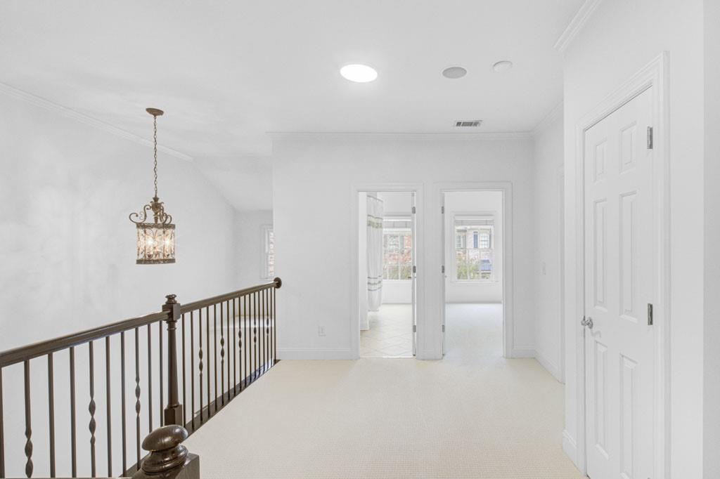 4428 Wilkerson Manor Drive, Unit 6 Smyrna, GA 30080 - Photo 16 of 27 a view of a hallway with chandelier and entryway