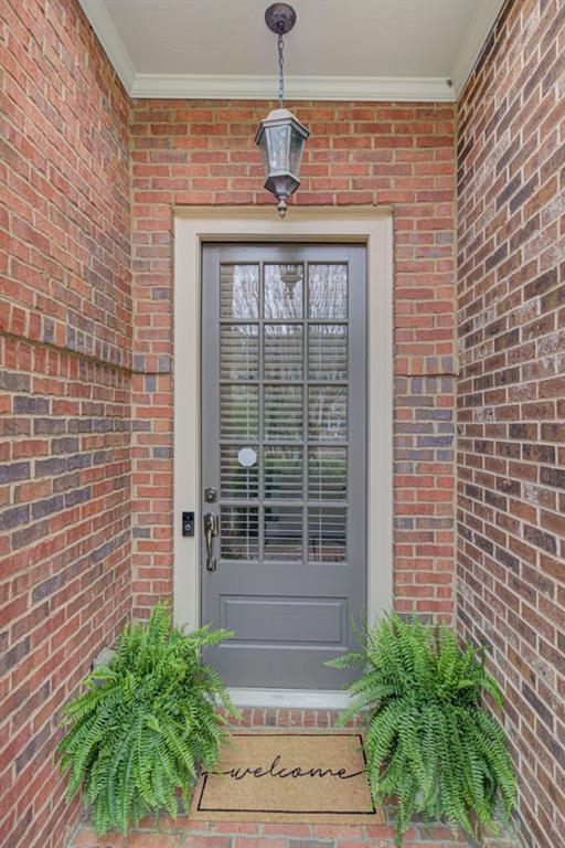 4428 Wilkerson Manor Drive, Unit 6 Smyrna, GA 30080 - Photo 2 of 27 a front view of a house with a yard