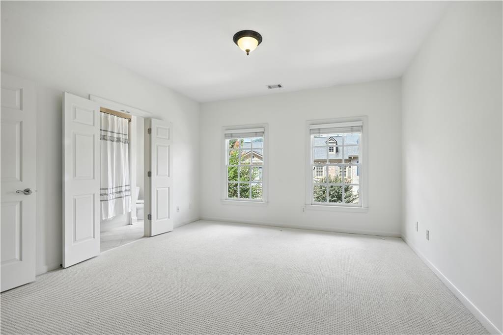4428 Wilkerson Manor Drive, Unit 6 Smyrna, GA 30080 - Photo 23 of 27 a view of an empty room with a window