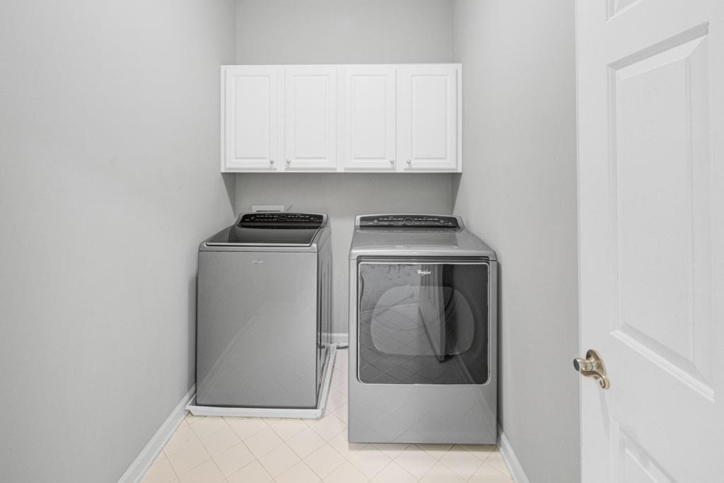 4428 Wilkerson Manor Drive, Unit 6 Smyrna, GA 30080 - Photo 27 of 27 a utility room with wooden floor washer and dryer