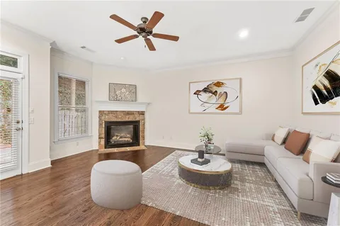a living room with furniture and a fireplace